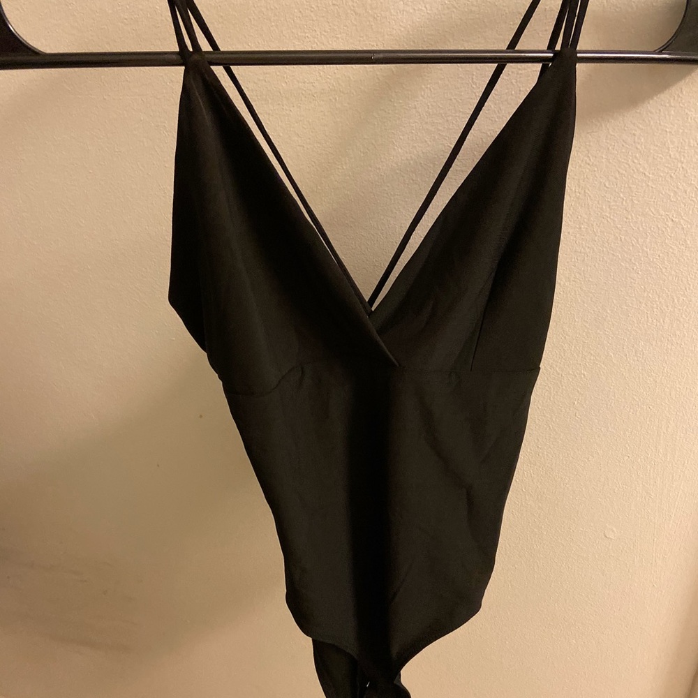 Low cut strappy black bodysuit